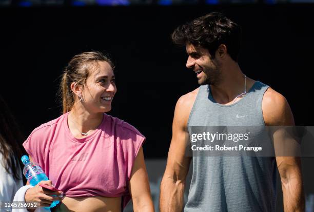 Paula Badosa of Spain and boyfriend Juan Betancourt walk off the court after practice at the Akron WTA Finals Guadalajara at Centro Panamericano de...