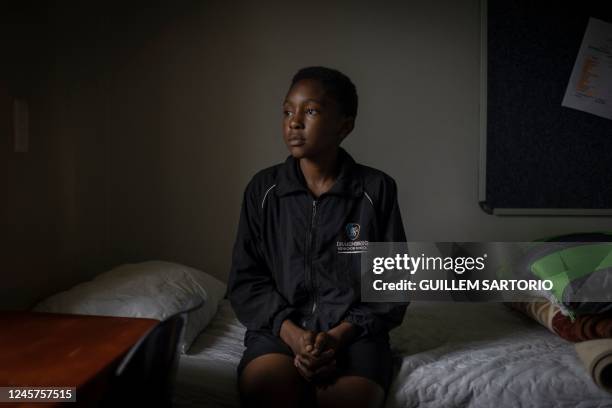 Zethembiso Fakude a student at the Drakensberg Boys Choir School, poses for a portrait in his bedroom at the school near Winterton on December 9,...