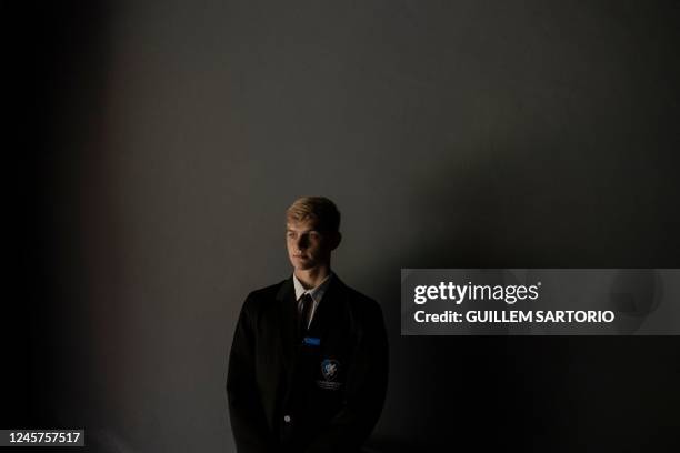 Nicholas Robinson a student at the Drakensberg Boys Choir School, poses for a portrait at the auditorium of the school near Winterton on December 10,...