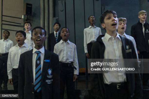Students from the Drakensberg Boys Choir School sing Christmas carols during a rehearsal for a Christmas function at the school near Winterton on...