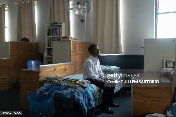 Ethan Palagangwe, a student at the Drakensberg Boys Choir School, poses for a portrait in his bedroom near Winterton on December 9, 2022. - The...