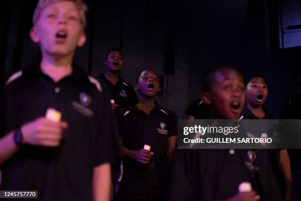 Students at the Drakensberg Boys Choir School sing Christmas carols during a rehearsal for a Christmas function at the school near Winterton on...