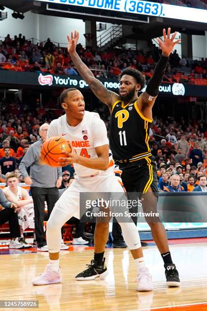Syracuse Orange Guard Quadir Copeland looks to pass the ball against Pittsburgh Panthers Guard Jamarius Burton during the second half of the college...