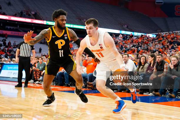 Syracuse Orange Guard Joseph Girard III dribbles the ball against Pittsburgh Panthers Guard Jamarius Burton during the second half of the college...