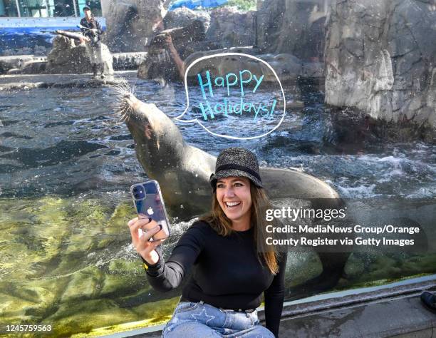 Long Beach, CA Leah Osier takes a selfie with a sea lion at the Aquarium of the Pacific in Long Beach, CA, on Tuesday, November 29, 2022.