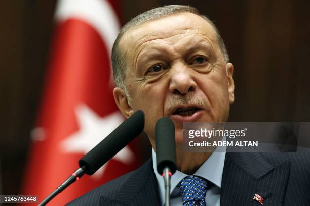 Turkish President and leader of the Justice and Development Party Recep Tayyip Erdogan delivers a speech during his party's group meeting at Turkish...