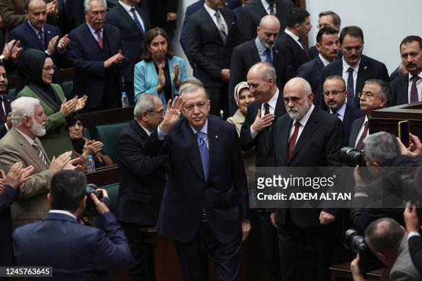 Turkish President and leader of the Justice and Development Party Recep Tayyip Erdogan greets the crowd during his party's group meeting at Turkish...