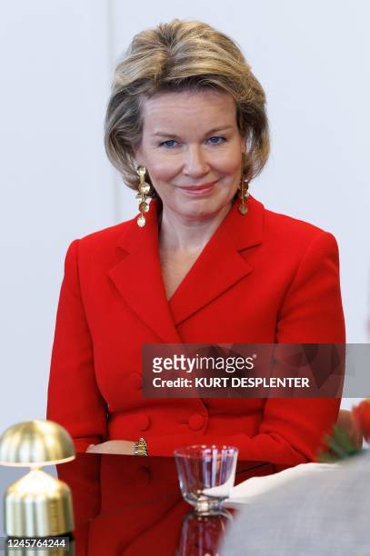 Queen Mathilde of Belgium poses during a royal Christmas visit to the 'Heilig Hart' care center for elderly people, in Kortrijk on December 21, 2022....