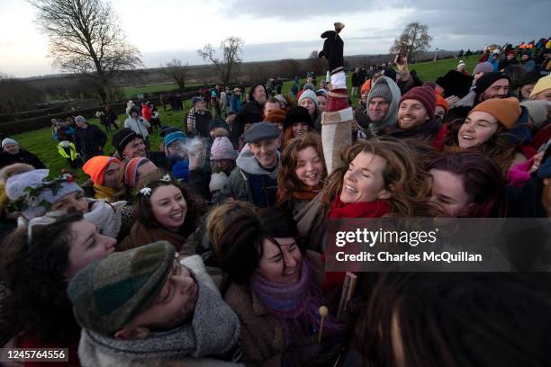 Group hug is seen as people gather to witness the winter solstice on December 21, 2022 in Newgrange, Ireland. Crowds are gathering at Newgrange in Co...