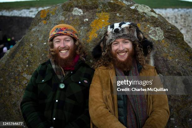 Twin brothers Keith and Deano Stapleton interact with one another as people gather to witness the winter solstice on December 21, 2022 in Newgrange,...
