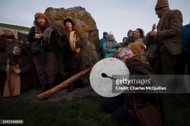Group of musicians play as people gather to witness the winter solstice on December 21, 2022 in Newgrange, Ireland. Crowds are gathering at Newgrange...