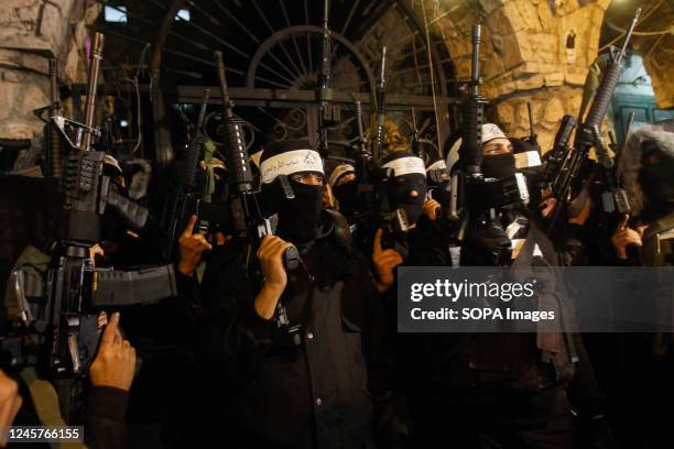 Palestinian gunmen from the Al-Aqsa Martyrs Brigades of the Fatah movement led by President Mahmoud Abbas appear carrying their weapons in protest...