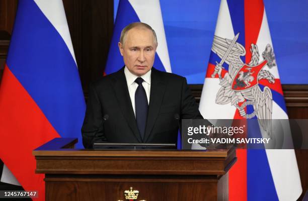 Russian President Vladimir Putin delivers a speech during an expanded meeting of the Russian Defence Ministry Board at the National Defence Control...