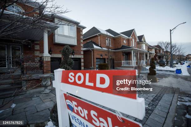 Sold" sign outside a home in Vaughan, Canada, on Tuesday, Dec. 20. 2022. Canadian home prices fell for a ninth straight month as sharply rising...