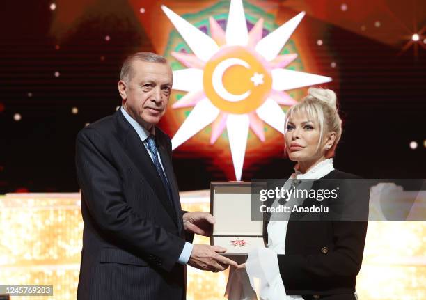 Turkish President Recep Tayyip Erdogan gives award to Turkish singer Ajda Pekkan during the Presidential Culture and Arts Grand Awards event in...