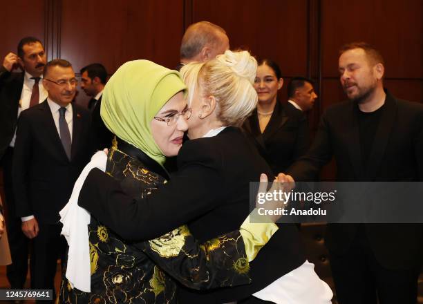 Turkish President's wife Emine Erdogan hugs with Turkish singer Ajda Pekkan during the Presidential Culture and Arts Grand Awards event in Ankara,...