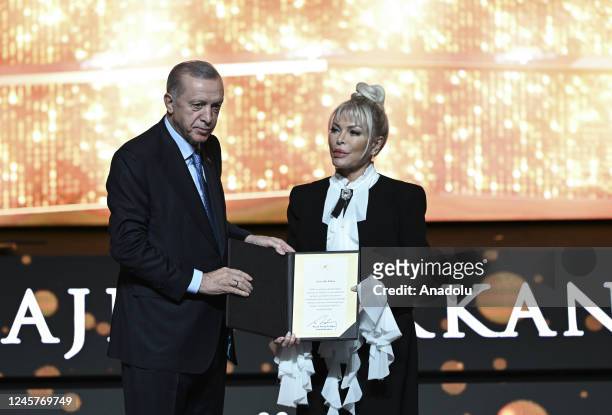 Turkish President Recep Tayyip Erdogan gives award to Turkish singer Ajda Pekkan during the Presidential Culture and Arts Grand Awards event in...