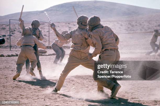 Young Al-Fatah guerilla recruits undergoing PLO commando training at a desert camp near the Israel border in Jordan during the Third Arab-Israeli or...