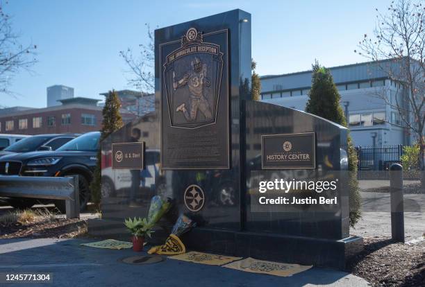 Flowers and terrible towels paying respect to Pittsburgh Steelers Pro Football Hall of Fame running back Franco Harris who passed away on Wednesday...