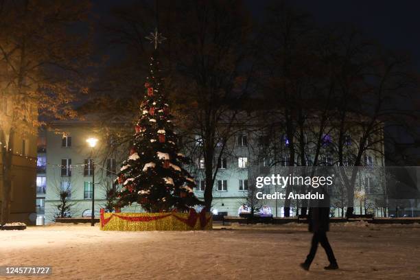 Christmas tree with turned off illumination is seen during âAn Hour for Ukraineâ in Tychy, Poland on December 21, 2022. In the shortest day of the...