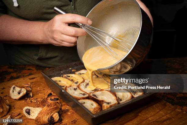 Green Plate Special about Too Good To Go Food Waste app. Christine Burns Rudalevidge pours a pumpkin custard mix over sliced day old chocolate...