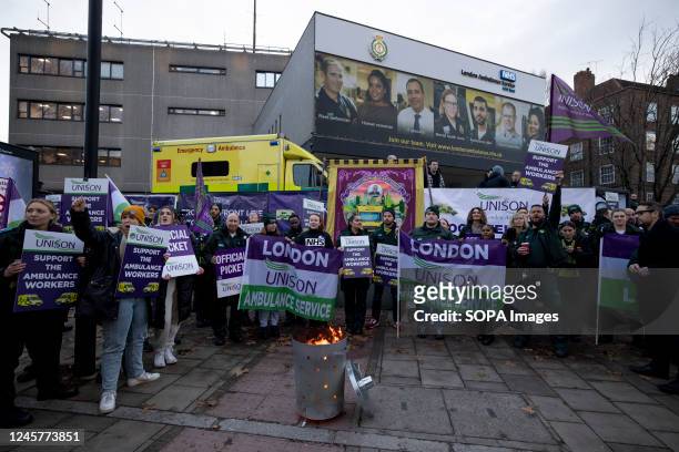 Ambulance workers, paramedics and call handlers from the London Ambulance Services are seen holding banners and placards expressing their opinion in...