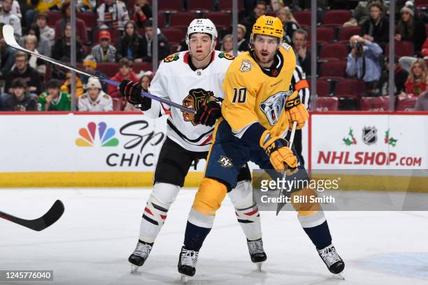 Ian Mitchell of the Chicago Blackhawks and Colton Sissons of the Nashville Predators stand in position on the ice in the second period at United...