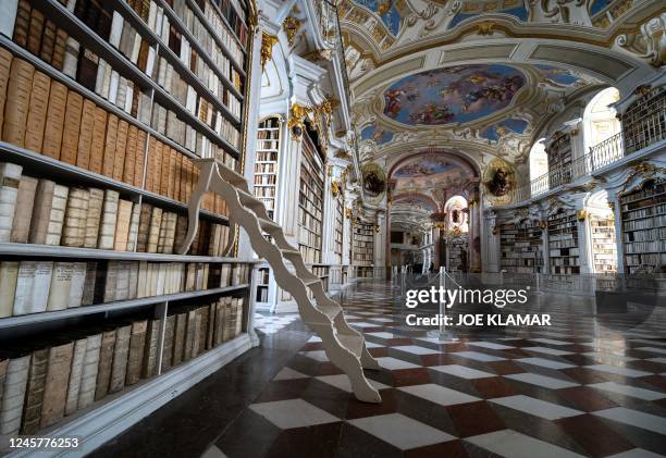 The library of the Benedictine Abbey in Admont, Austria is pictured on December 6, 2022. - The Admont abbey library nestled amid the mountains of...