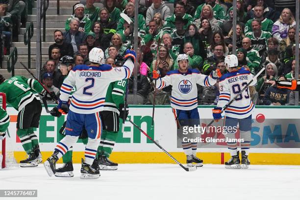 Evan Bouchard and Ryan Nugent-Hopkins of the Edmonton Oilers celebrate a goal against the Dallas Stars at the American Airlines Center on December...