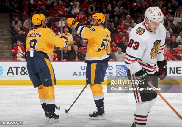 Roman Josi of the Nashville Predators celebrates after scoring against the Chicago Blackhawks in the third period at United Center on December 21,...