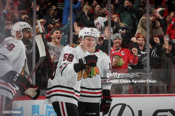 MacKenzie Entwistle of the Chicago Blackhawks reacts after scoring against the Nashville Predators in the second period at United Center on December...