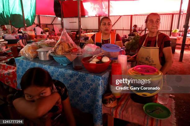 Aida Araceli Trinidad Rasgado left to right, mother Luvia Rasgado Villalobos and grandmother Vicenta Villalobos Vicente at their food stall Fonda...