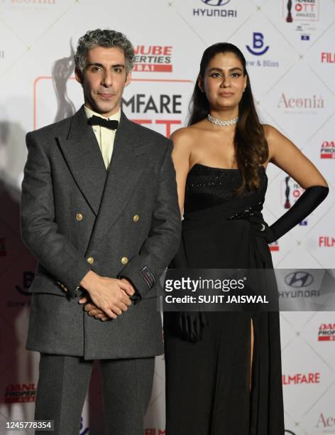In this picture taken on December 21 Bollywood actors Jim Sarbh and Shreya Dhanwanthary poses for pictures at the 'Filmfare OTT Awards 2022' in...
