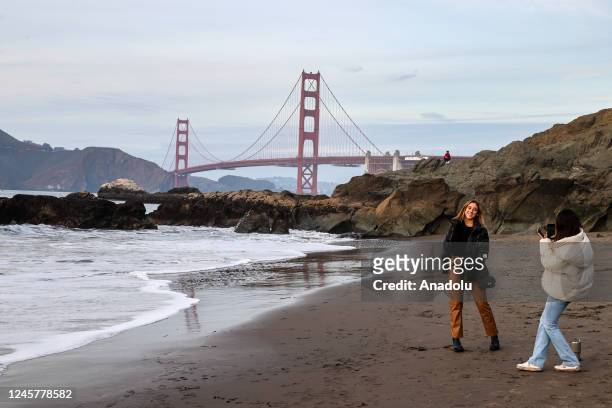 Women are seen at Marshall's Beach by the Golden Gate Bridge in San Francisco, California, United States on December 21, 2022.