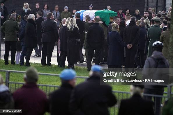 Sean Roney The coffin of Private Sean Rooney is carried into Holy Family Church ...