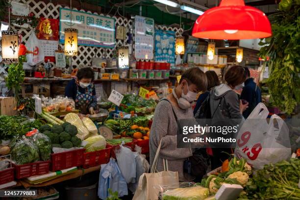 People buying Food at a wet market on December 22, 2022 in Hong Kong, China. The Dongzhi Festival or Winter Solstice Festival celebrated by the...