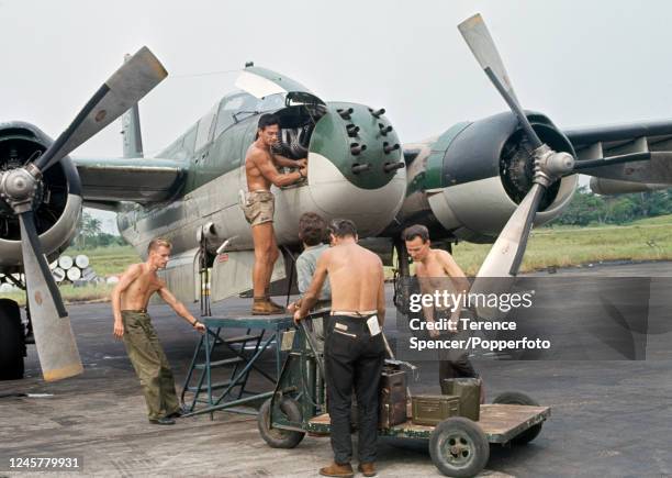 Cuban mercenary pilots arming their aircraft during the Congo Crisis, circa January 1965.