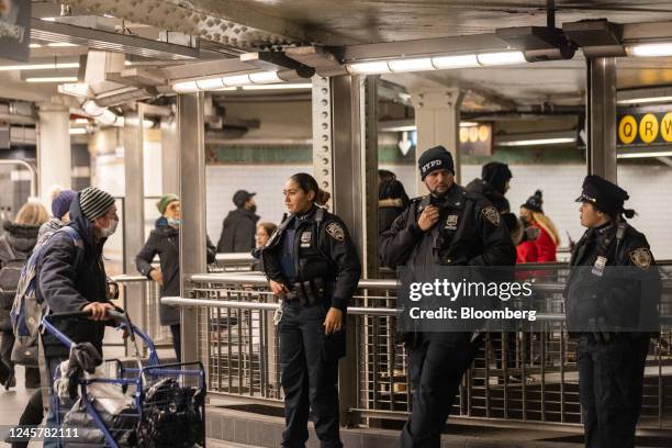 New York Police Department officers at the Times Square-42nd Street subway station in New York, US, on Wednesday, Dec 21, 2022. New York's...