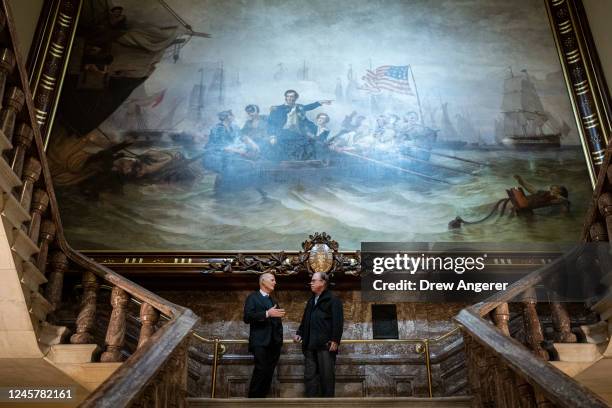 Under the Battle of Lake Erie painting by William Henry Powell, Sen. Rick Scott talks with Sen. Mike Braun at the U.S. Capitol on December 22, 2022...
