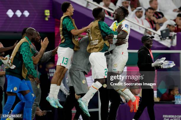 Famara Diedhiou of Senegal celebrates 0-2 with Ismail Jakobs of Senegal, Pape Gueye of Senegal during the World Cup match between Qatar v Senegal at...