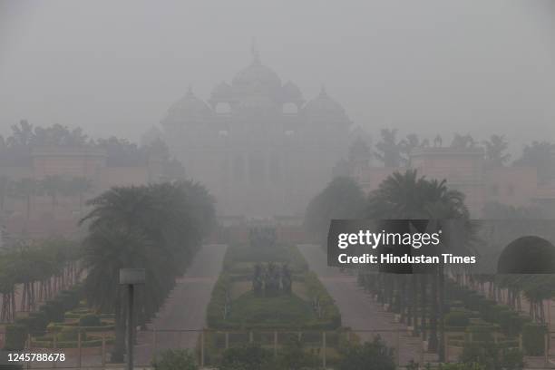 View of Dense fog during morning hours, at Akshardham Temple on December 22, 2022 in New Delhi, India. Delhi along with Uttar Pradesh, Punjab,...