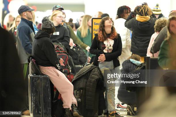 Ella Silverstein lookup air during her waiting in the line to book flight in front of Southwest Airlines ticket counter at Denver International...