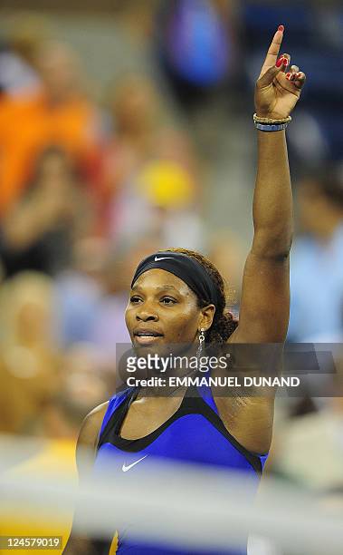 Tennis player Serena Williams celebrates after winning against Denmark's Caroline Wozniacki during their Women's US Open 2011 semifinals match at the...
