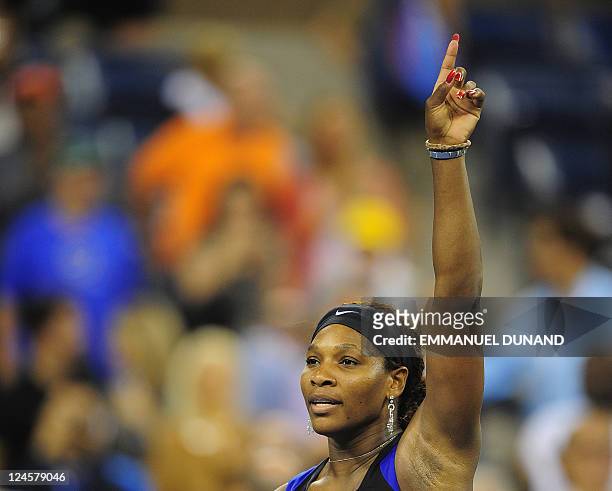 Tennis player Serena Williams celebrates after winning against Denmark's Caroline Wozniacki during their Women's US Open 2011 semifinals match at the...