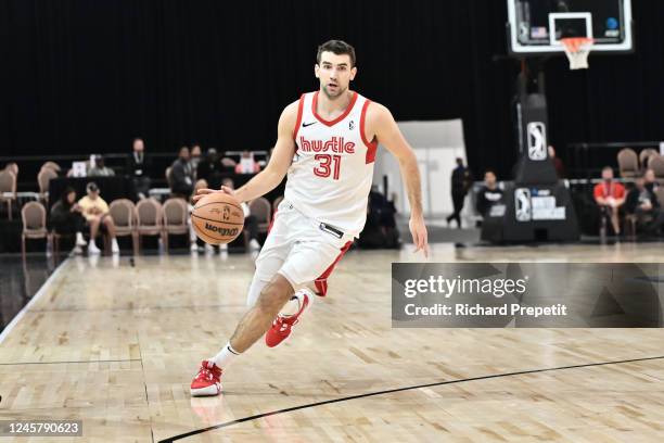 Dakota Mathias of the Memphis Hustle dribbles the ball during the game against the Motor City Cruise during the 2022-23 G League Winter Showcase on...