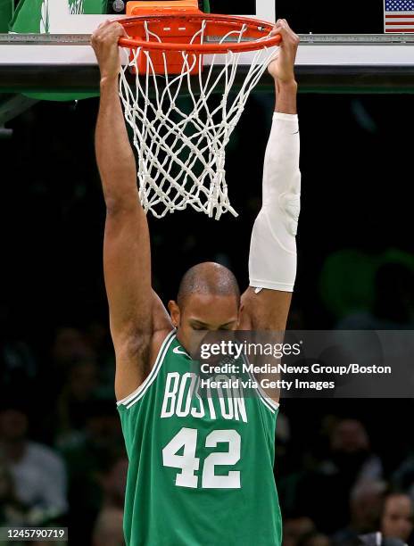 December 21: Al Horford of the Boston Celtics hangs on the basket before the second half of the NBA game against the Indiana Pacers at the TD Garden...