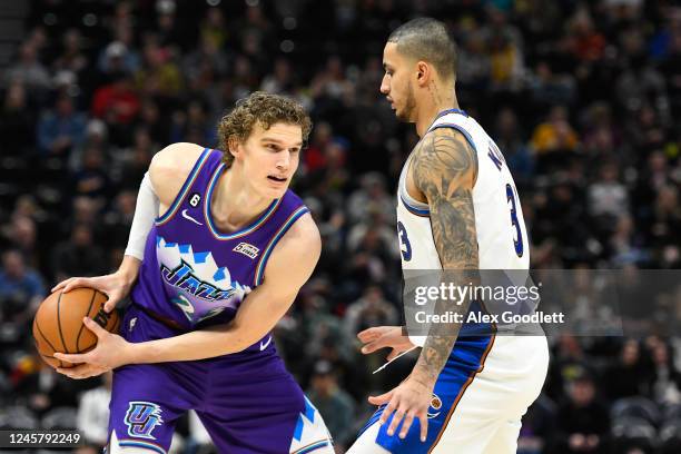 Kyle Kuzma of the Washington Wizards defends Lauri Markkanen of the Utah Jazz during the second half of a game at Vivint Arena on December 22, 2022...