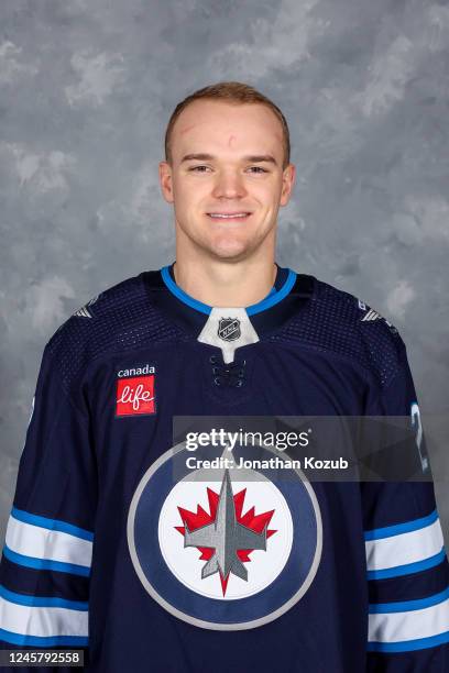 Karson Kuhlman of the Winnipeg Jets poses for his official headshot for the 2022-2023 season on December 15, 2022 at Canada Life Centre in Winnipeg,...
