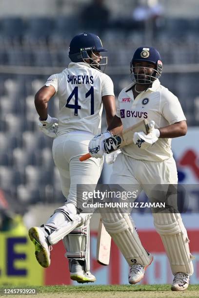 India's Shreyas Iyer and Rishabh Pant run between the wickets during the second day of the second cricket Test match between Bangladesh and India at...