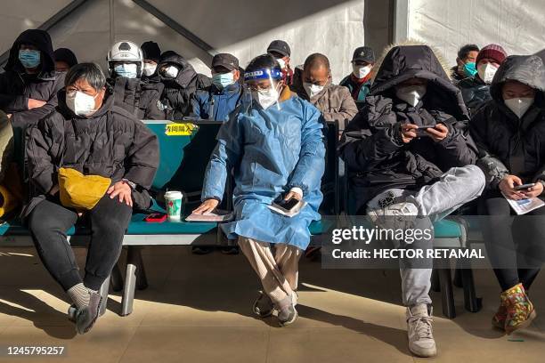 People wait for medical attention at Fever Clinic area in Tongren Hospital in the Changning district in Shanghai, on December 23, 2022 - China is...